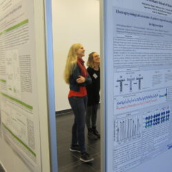 PhD researchers Laura and Anna happy at the poster wall