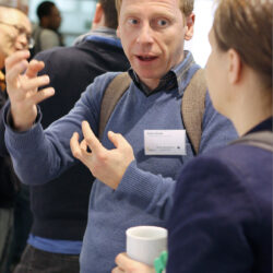 Prof. Anton Sirota in discussion with a PhD student