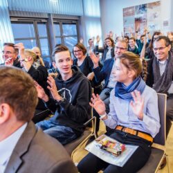 The IGSN family and friends applaud the first prize winners in sign language
