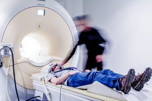 Person undergoing a medical MRI scan in a clinical setting